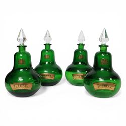 Set of four 20th century Royal Pharmaceutical Society green glass bottles, of bellied form...