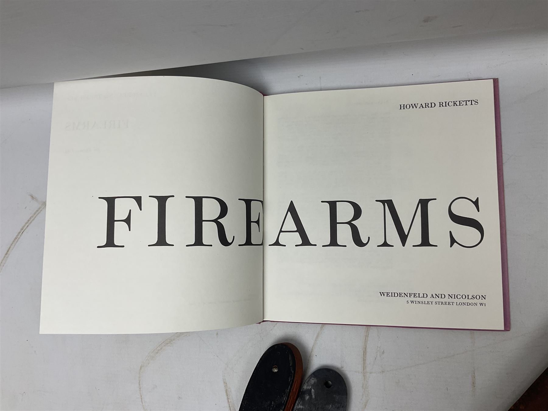 George V 1897 pattern Infantry officers sword, the 82cm single fullered blade with traces of etched detail and George V crown cipher, the ricasso marked Hawksworth Sheffield, pierced half basket hilt with George V cypher, wire-bound fish-skin grip with brass pommel and backstrap; in leather scabbard L102cm overall; together with two sectional gun cleaning rods; swagger stick made of leather strips etc