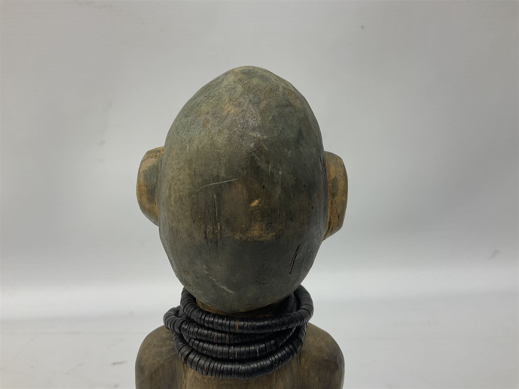 Early 20th century West African Yoruba family wooden figure of Orisha Oko, the god of farming/agriculture, carved from the solid, bears manuscript label of provenance verso H26.5cm