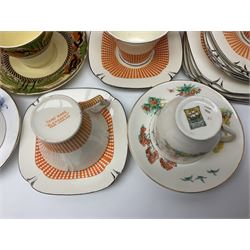 Four Portmeirion storage jars with Greek key pattern on an orange ground, together with Tams Ware tea service and other ceramics