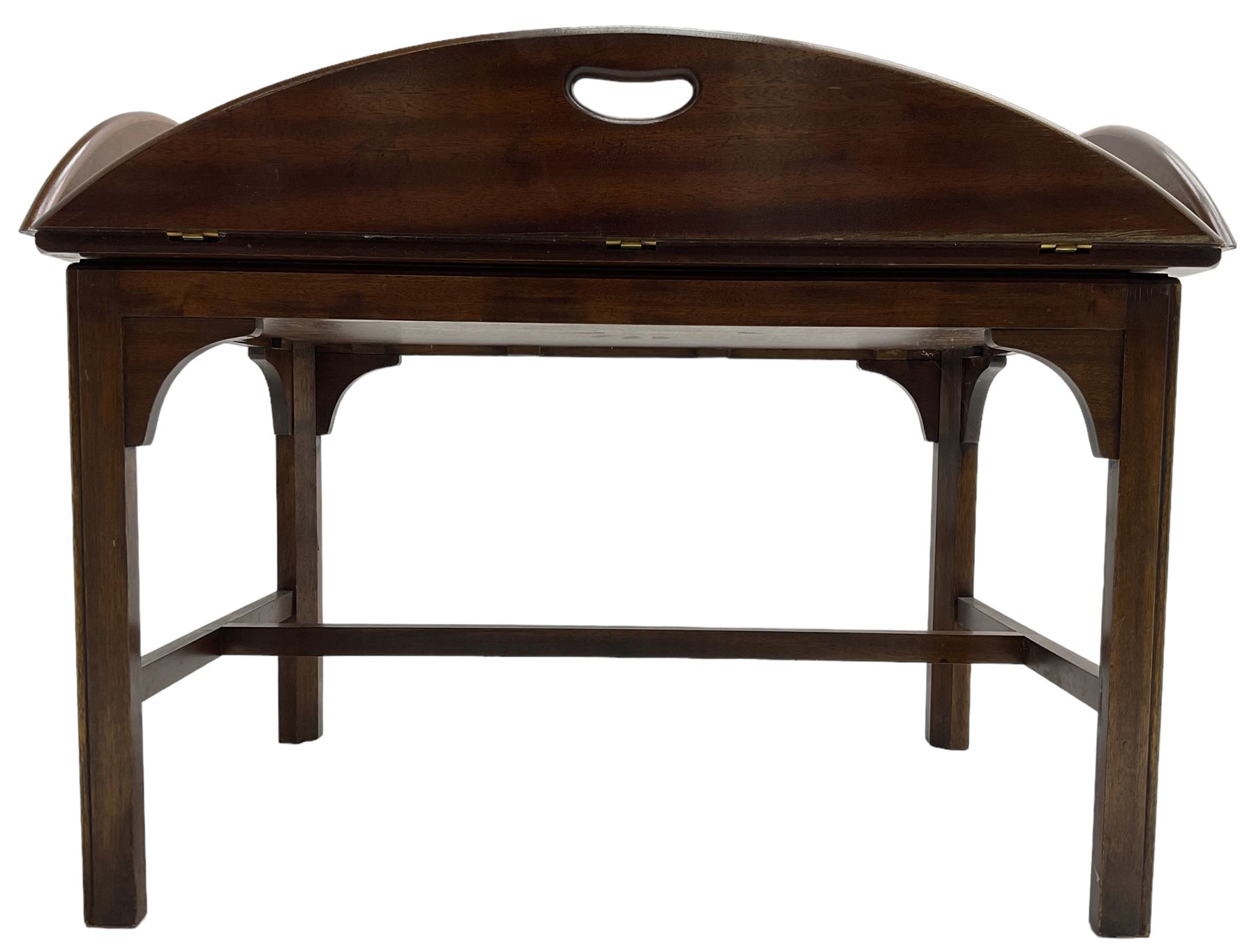 Mahogany butler's tray top coffee table, the removable tray with hinged sides and ends pierced with handles, on square moulded supports united by H stretcher 