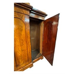 19th century mahogany break-fronted quadruple wardrobe, stepped and moulded projecting cornice over four arch panelled doors, moulded plinth base on blocks 