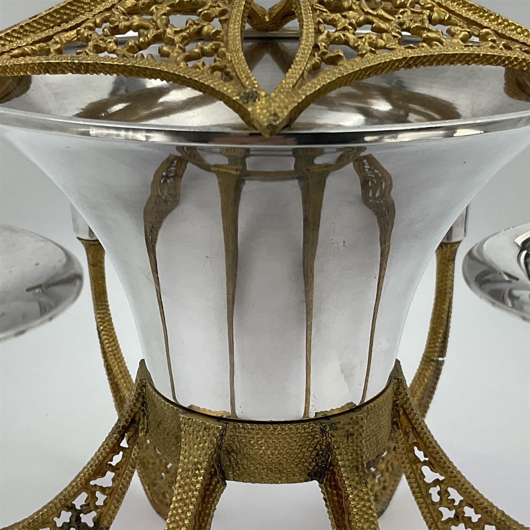 Modernist silver plated candelabra centrepiece by Stuart Devlin, with six pierced gilt branches supporting a central tapering cylindrical rose bowl and six fluted candle holders, with detachable star shaped gilt cover, stamped SD, TG to underside of central bowl, overall H17cm