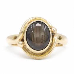 9ct gold black sapphire ring, bezel set with a single cabochon cut sapphire, London 1996