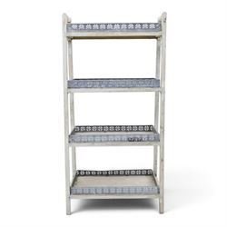 OKA style four tiered waterfall bookshelf, painted woodened frame with pierced wrought metal gallery