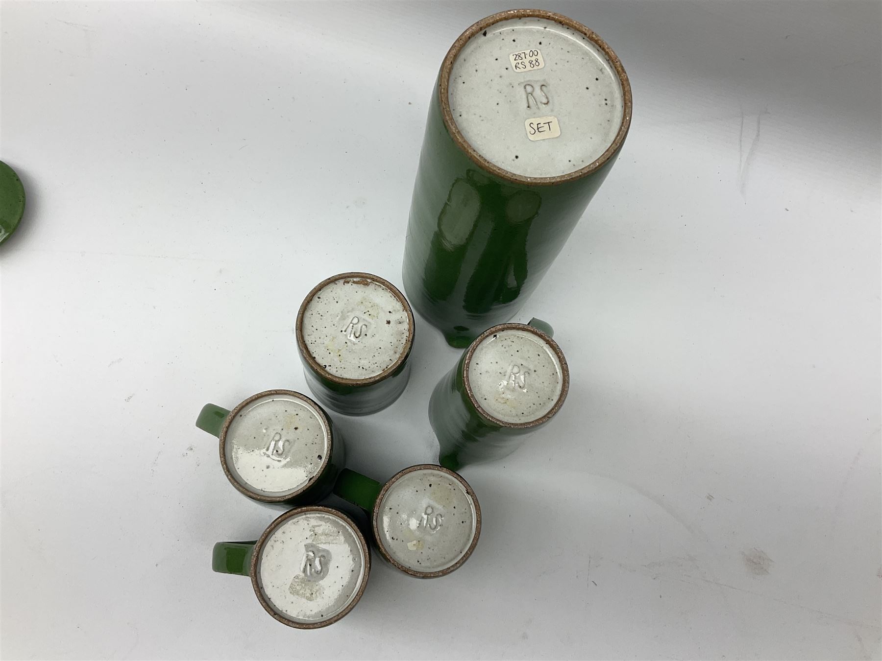 Rupert Spira (born 1960) stoneware coffee service decorated with vivid green glaze, comprising coffee pot, three cups, lidded sucrier and milk jug, all having impressed RS marks beneath, tallest H25cm