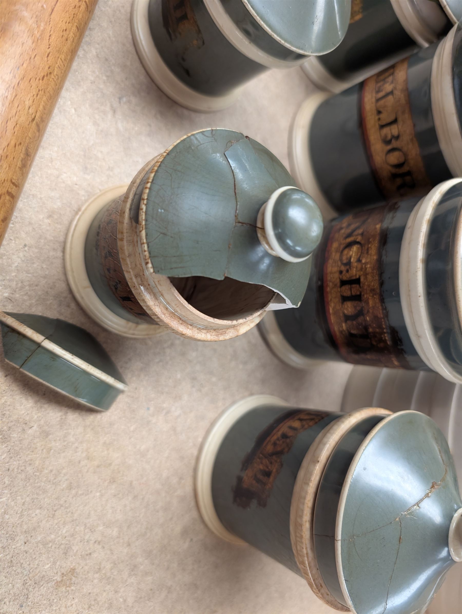 19th century sage green apothecary jars with gilt labels, four white ceramic kitchen jars and a stoneware flaggon marked Wheat Wine