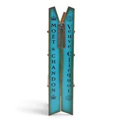 Contemporary wooden folding stepladder, three treads to each side, turquoise painted panels bearing champagne logos, with metal hinges and folding stays