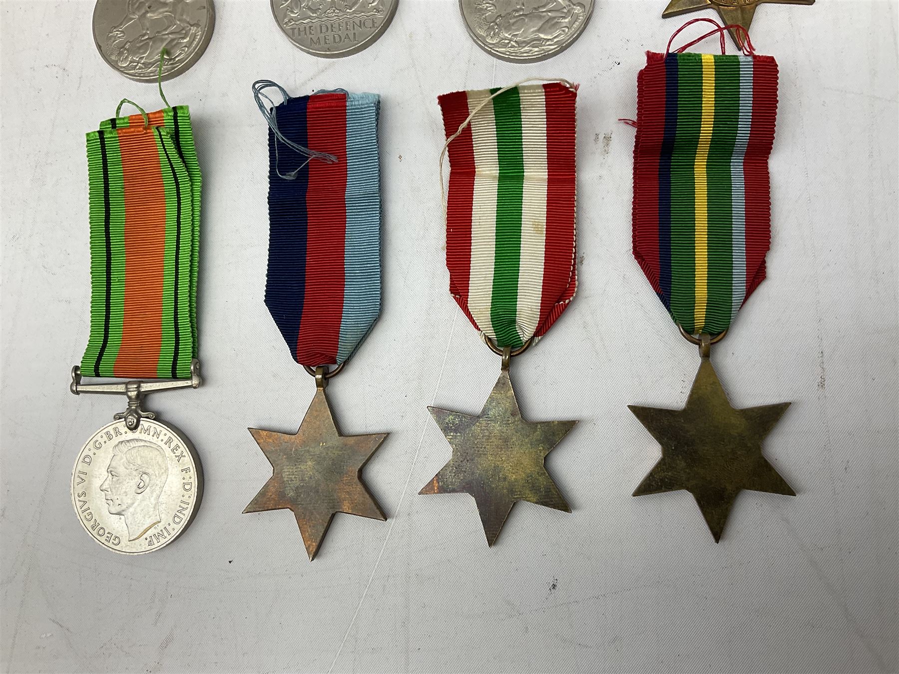 Eight WW2 medals comprising two War Medals 1939-1945, two Defence Medals, Atlantic Star, Italy Star, Pacific Star and 1939-1945 Star; all with ribbons (8) 