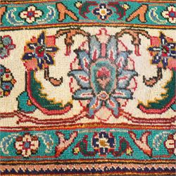 Persian Kashan carpet, red madder field, all over design of scrolling palmettes and flowering vines framed by an ivory border of lotus and arabesques between turquoise and red floral guards 294x387cm