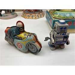 Mid 20th century and later tin plate clockwork toys, to include merry-go-rounds, spaceship carousel, walking robot, Schylling airport control tower, monkey riding horse, astronaut space station etc, including German and Japanese examples, some with boxes (12)