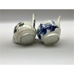 Two 18th century miniature or toy pearlware teapots, the first example lacking cover decorated with an exotic bird, the second with cover painted in underglaze blue with hut and fence, second example approximately H8cm