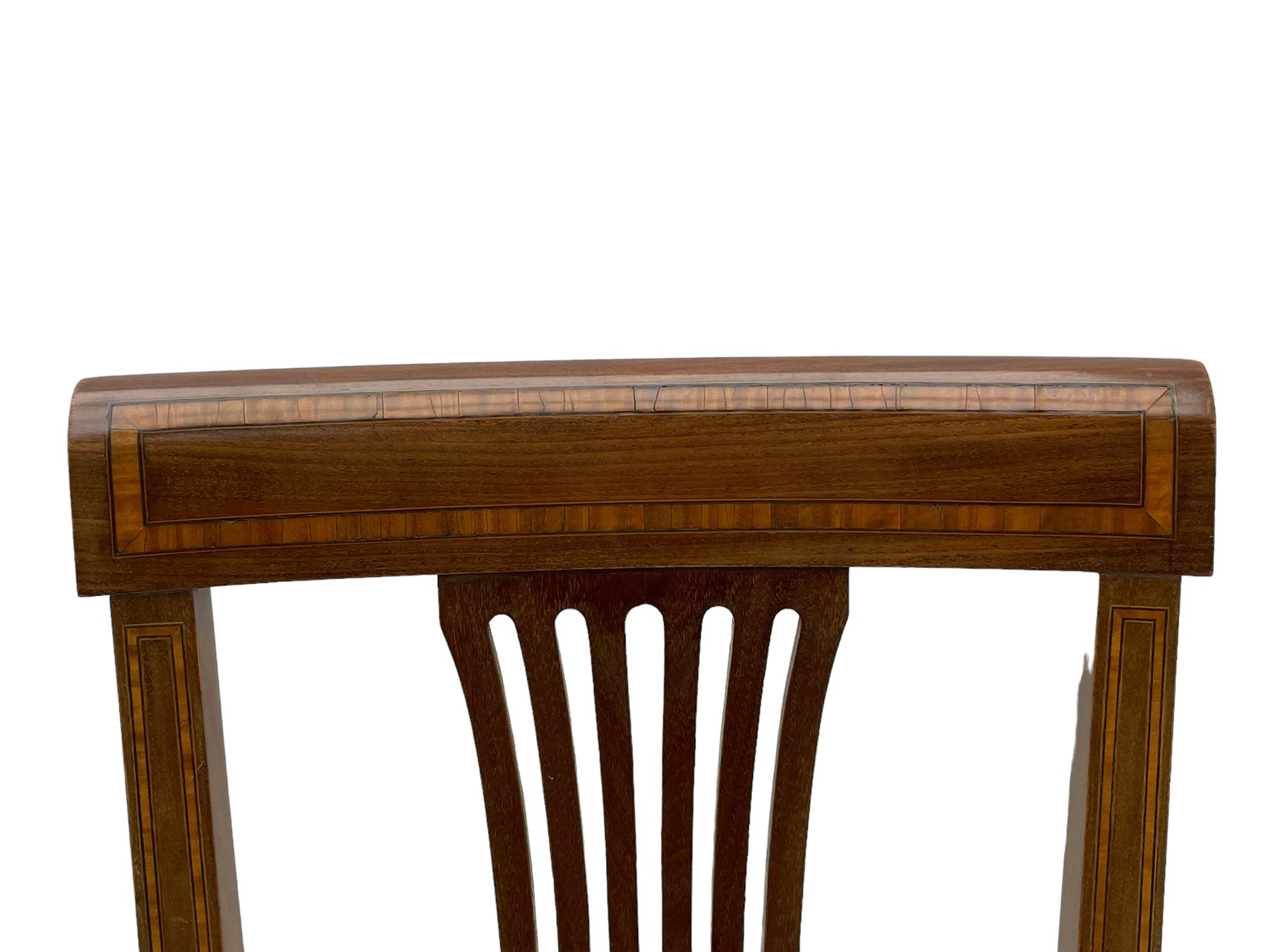 Set twelve (4+8) Edwardian inlaid mahogany dining chairs, cresting rail with satinwood banding, pierced splat backs with central inlay, drop-in seats upholstered in foliate patterned ivory fabric, raised on square tapering supports terminating in spade feet