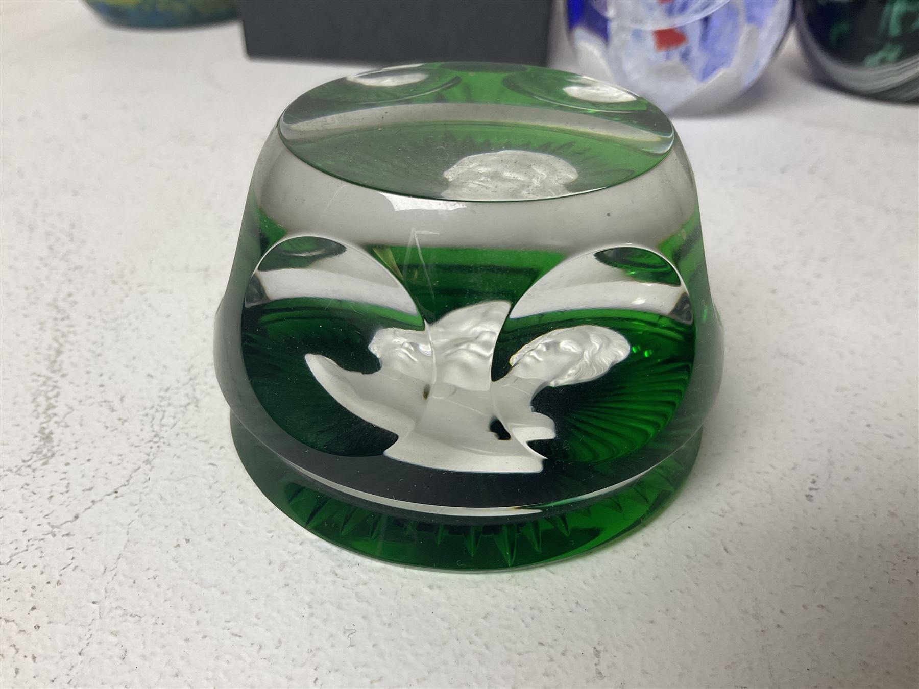 Twelve Caithness glass paperweights, to include Pastel, Mooncrystal and Fiesta, together with Baccarat 'The Princess Anne' paperweight and two Mdina examples (15)