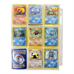 Collection of mainly vintage Pokemon cards including Charizard Base Set Holographic number 4/102 and two Ancient Mew 2000 promo cards, some housed within plastic wallets and some loose