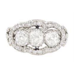 Late 19th / early 20th century platinum diamond ring, three old cut diamonds, in an openwo...