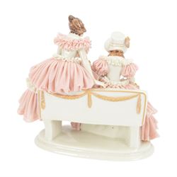 Three Continental lace figures, to include a Sitzendorf example modelled as a dancer with lace skirt, top and cuffs, upon a gilt detailed base, with printed mark beneath, H22cm 