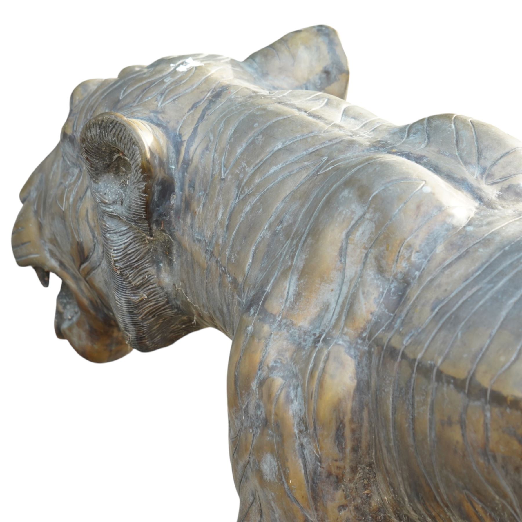 Pair of Chinese cast bronze tiger figures, one in a seated resting pose and the other advancing with open mouth, both with incised striping and aged bronze patina
Seated tiger (H 54cm, W 63cm, L 129cm)
Stood tiger (H 76cm, W 40cm, L 176cm) 