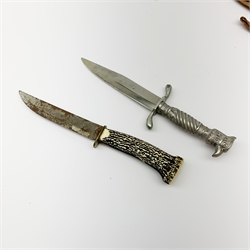 20th century hunting knife with 13cm single edge blade, cast white metal hilt with S-shaped quillon, wrythen grip and eagle head pommel L25cm overall; and another hunting knife with Solingen 12cm blade and simulated stag antler grip, both in leather sheath (2)