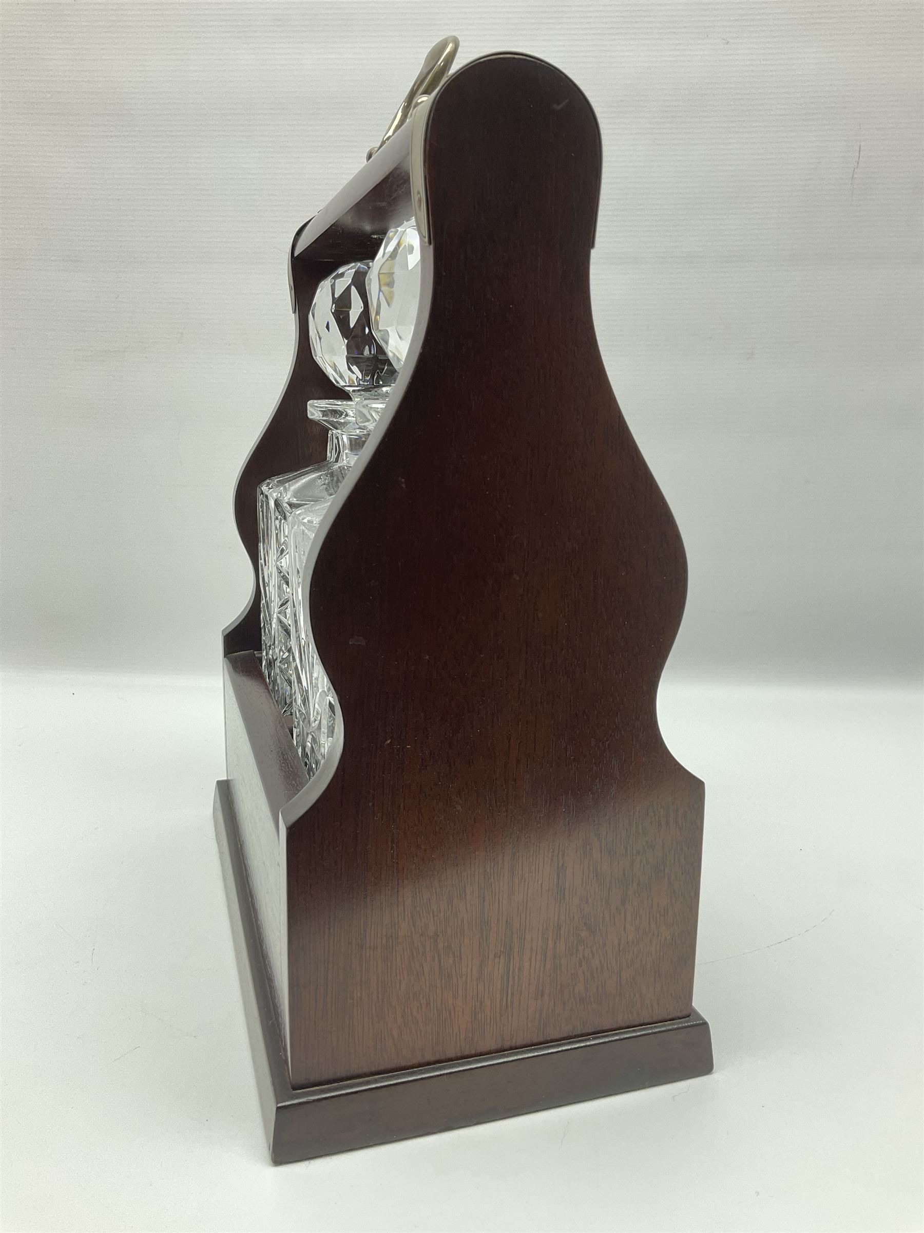 20th century mahogany tantalus with plated mounts and handle, with two recesses containing two square sided cut glass decanters, with key, including handle H36cm W27cm