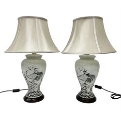 Pair of table lamps of tapering form, decorated with herons wading amongst reeds, on a white ground, with a circular footed base, including shades H66cm