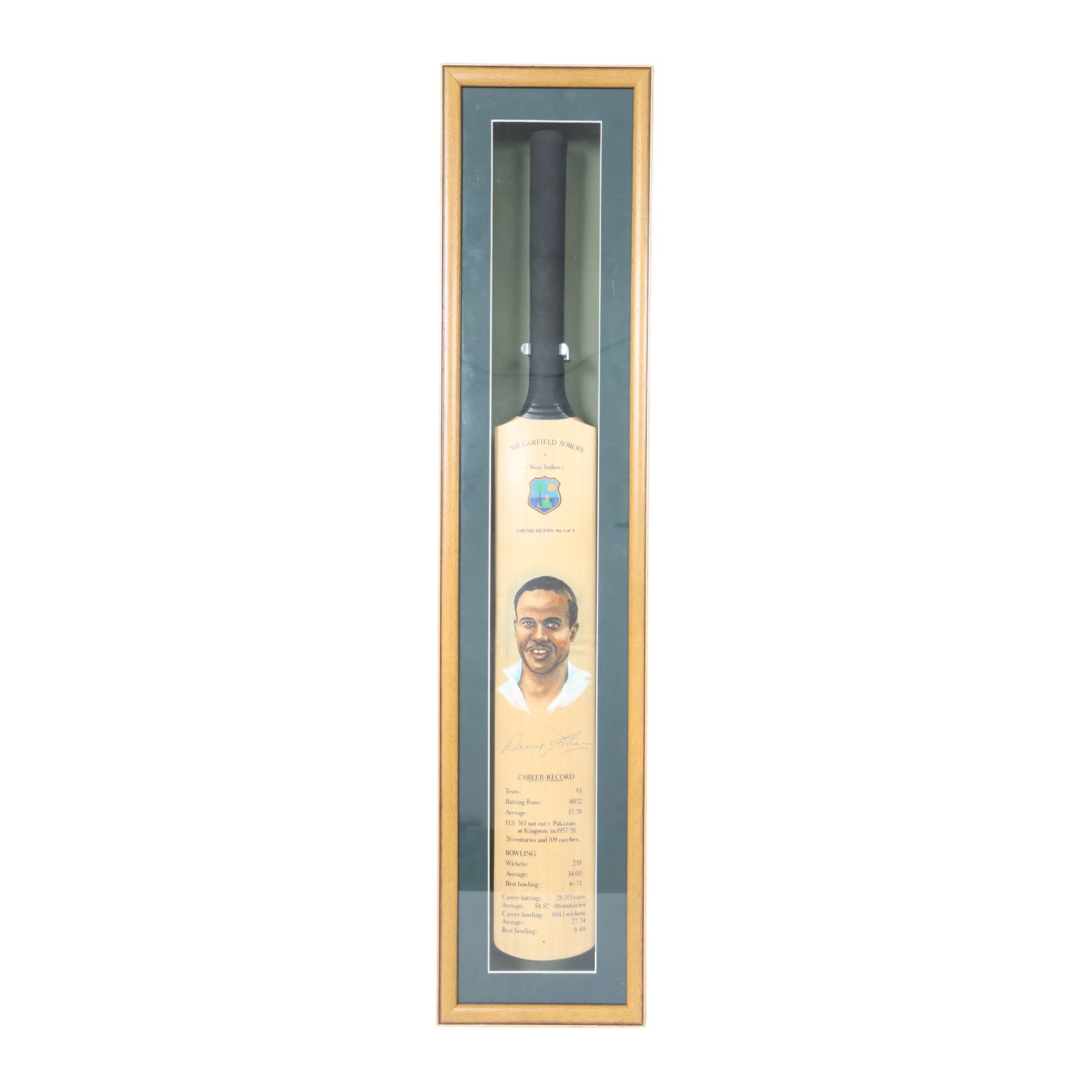 Limited edition signed Sir Garfield Sobers Career Record cricket bat limited edition no. 1of 3, in glazed display case, together with a Sir Garfield Sobers career record montage, with signed miniature bat and four black and white photographs, framed, tallest H97cm