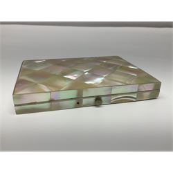 Victorian mother of pearl tea caddy, of rectangular bow-fronted form, the body with floral, bird and geometric engraved mother of pearl panels, white metal shield plaque to the cover inscribed with the initials G.J.A and similar escutcheon, the two division interior with ivory edging and two panelled mother of pearl lids, on four vegetable ivory bun feet L20cm, together with a similar style mother of pearl card case (2) This item has been registered for sale under Section 10 of the APHA Ivory Act