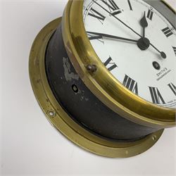 A 20th century Smiths brass cased bulkhead clock with a single train eight-day going barrel movement and balance escapement, white enamel dial with Roman numerals, minute track and five-minute Arabic’s, steel spade hands and centre second hand, dial inscribed “Smiths, Cricklewood N.W, Made in England” brass cast bezel with lock and key, flat glass with silvered sight ring, slow fast balance regulation.
Case diameter 22cm, bezel diameter 19cm.
With key

