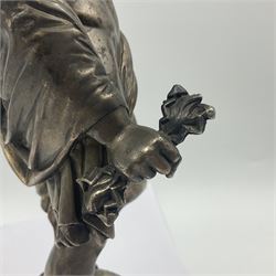 20th century silver plated figure, modelled as a classical male figure, possibly Prometheus, holding flames, one foot resting atop a small dragon, upon a circular spreading base, overall H37.5cm