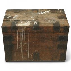 19th century metal bound ship’s trunk, of trapezoidal form with hinged lid, iron strapwork and corner reinforcements, remains of paper lining to interior