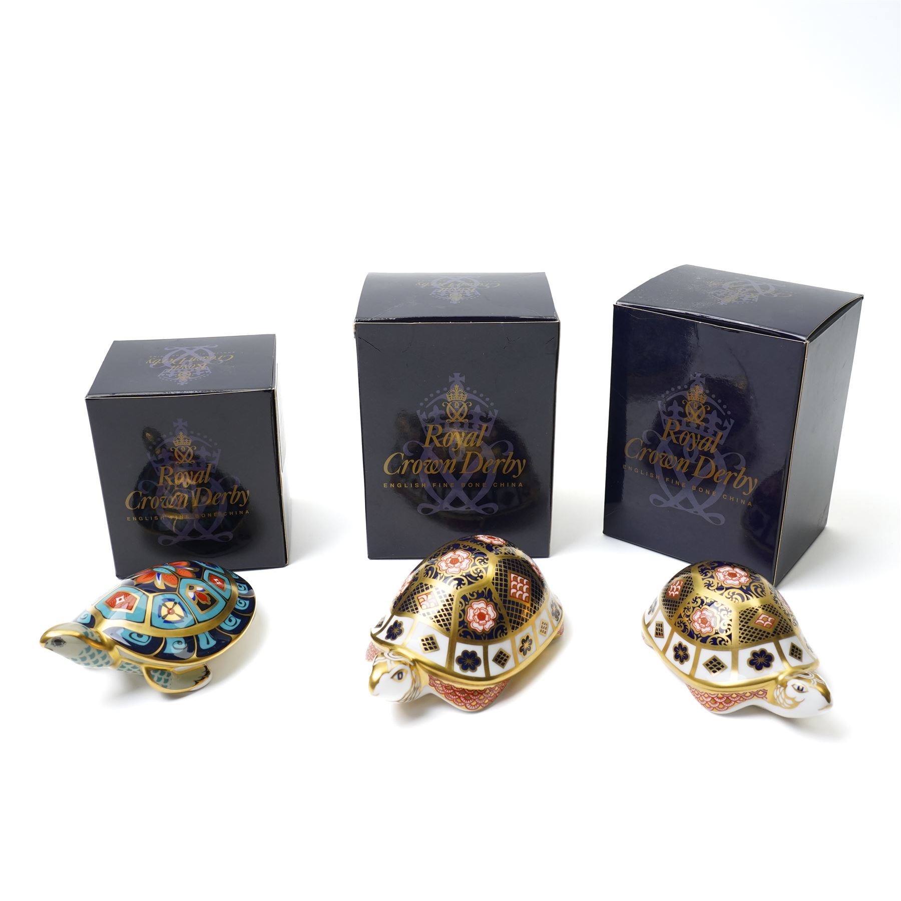 Three Royal Crown Derby paperweights, comprising two Yorkshire Rose Tortoises, and a Terrapin, all with gold stoppers, all boxed (3)