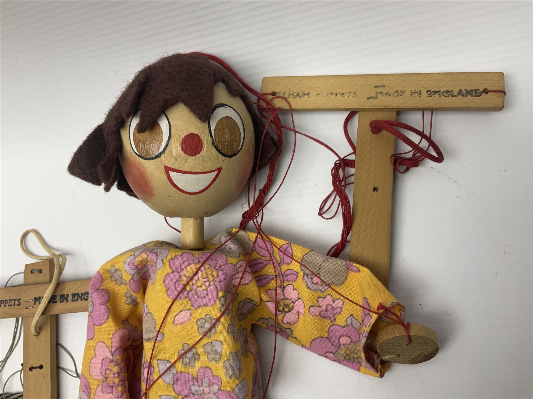 Pelham Puppet - three puppets comprising a painted wooden duck with felt mouth and wings with metal joints H12cm, in original box and instructions; and two further examples Type A cat with a hollow body H12cm, and a boy H23cm (3) 