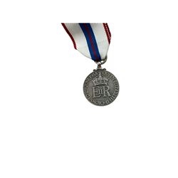 ER ll Coronation Medal, together with ribbons etc 