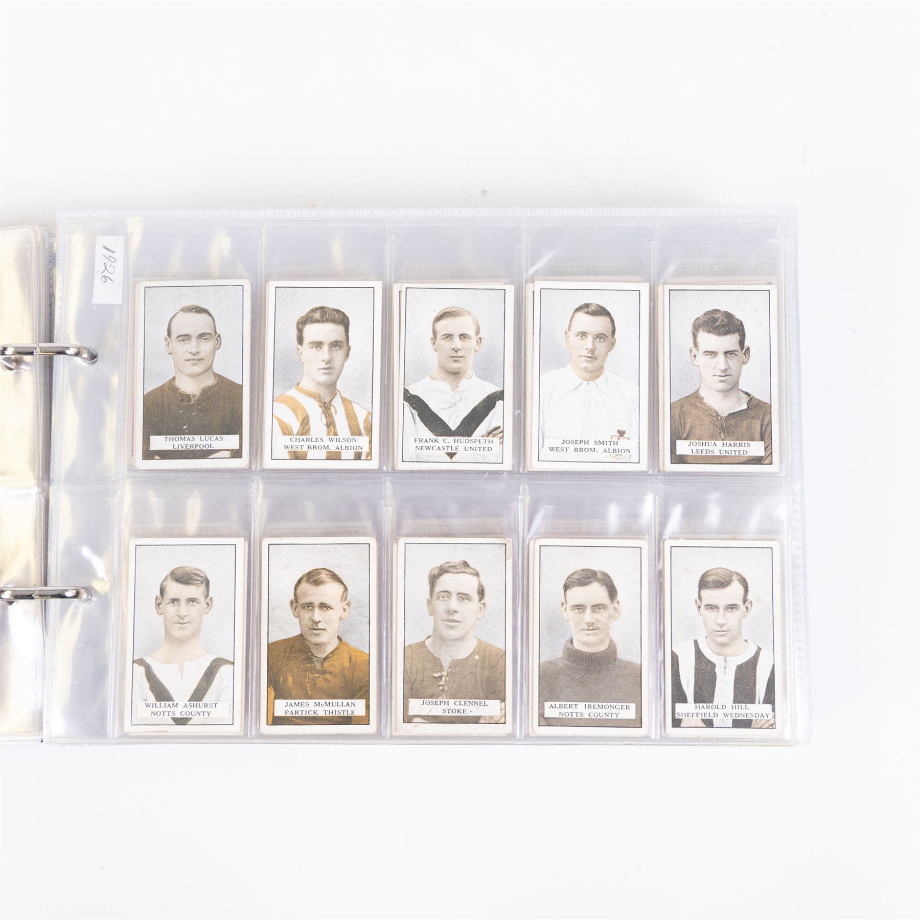 Collection of Edwardian and later Football related trading and cigarette cards, including forty-nine of fifty 1906 Ogden's Football Club Colours, 1922 PALS Footall series, ninety of one hundred 1925 Gallaher Famous Footballers, complete set of forty-four 1926 Ogden's Captains of Association Football Clubs and Colours, complete set of fifty 1927 Players Football Caricatures by MAC,  complete set of fifty 1927 Players Football Caricatures by RIP,  complete set of fifty 1930 Players Association Cup Winners, complete set of 50 1933 Ogdens AFC Nicknames etc, housed in brown cigarette card album