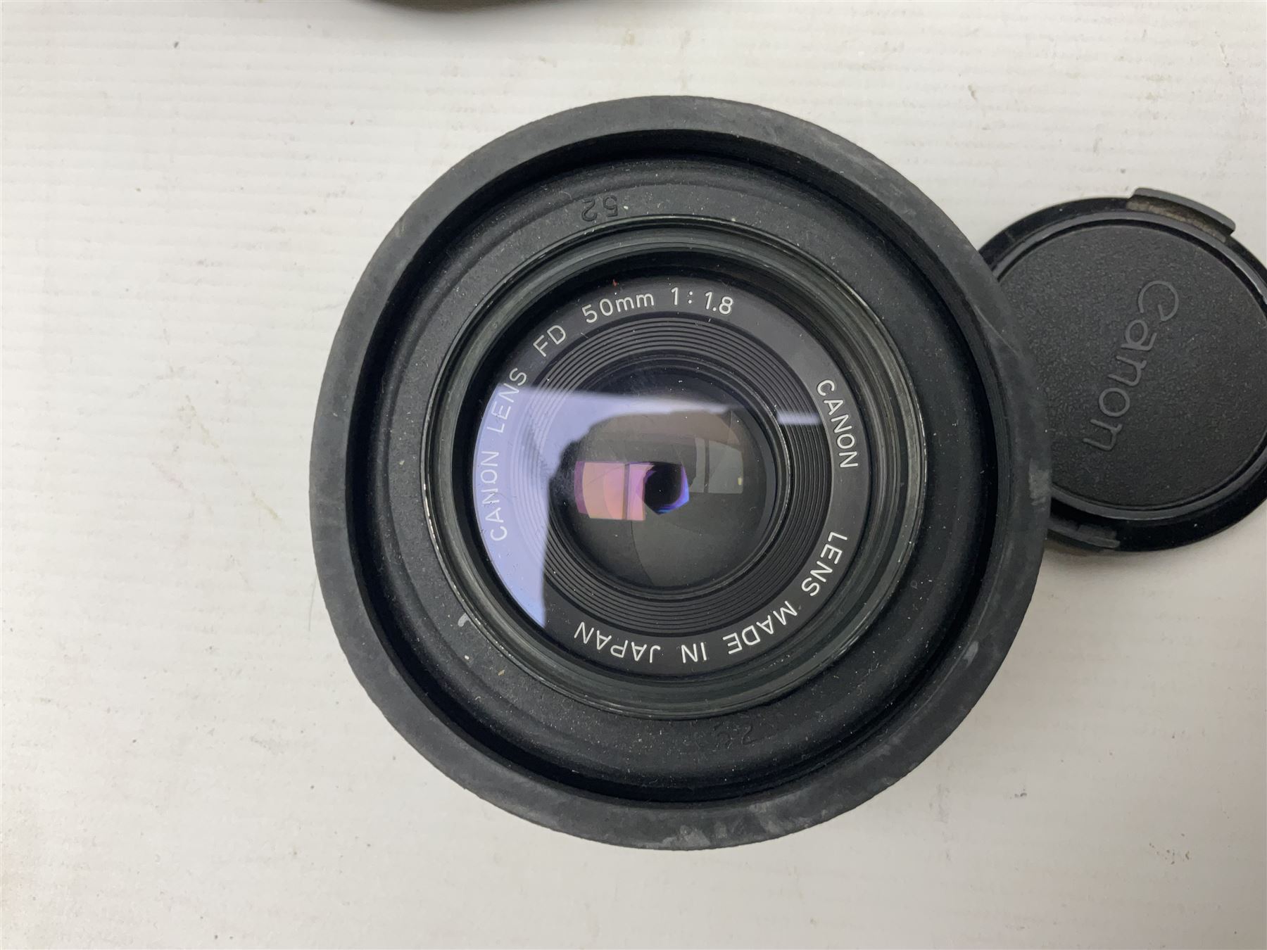 Canon A1 camera body, serial no 775843, together with 'Canon Lens FD 200mm 1:4 lens' serial no 24432, together with Semi Minolta folding camera, Canon 'Zoom FD 35-105mm 1:3.5-4.5' lens, Canon 'Macro Focusing Zoom 72mm Hanimex HMC 28-200mm' lens and other camera equipment  