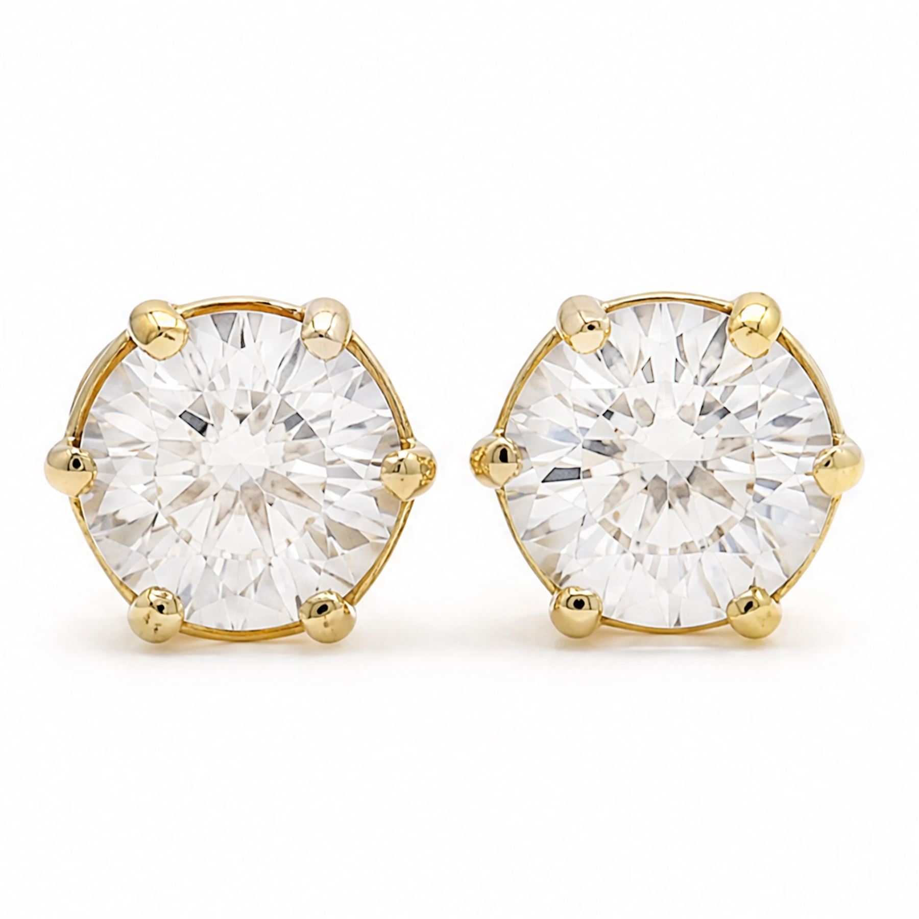 Pair of 18ct gold diamond earrings, each screw back stud set with a single round brilliant cut diamond, total diamond weight approx 3.15 carat
