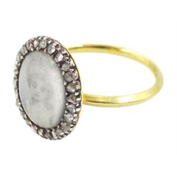 18th / 19th century gold and silver diamond portrait ring, set with an oval miniature of a woman on ivory, under glazed panel, with rose cut diamond surround and angular shank. This lot has been registered for sale under Section 10 of the APHA Ivory Act