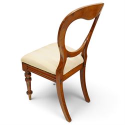 Set of twelve Victorian walnut balloon-back dining chairs, shaped open back over seats upholstered in striped ivory fabric, moulded seat rail above turned and tapering suppors