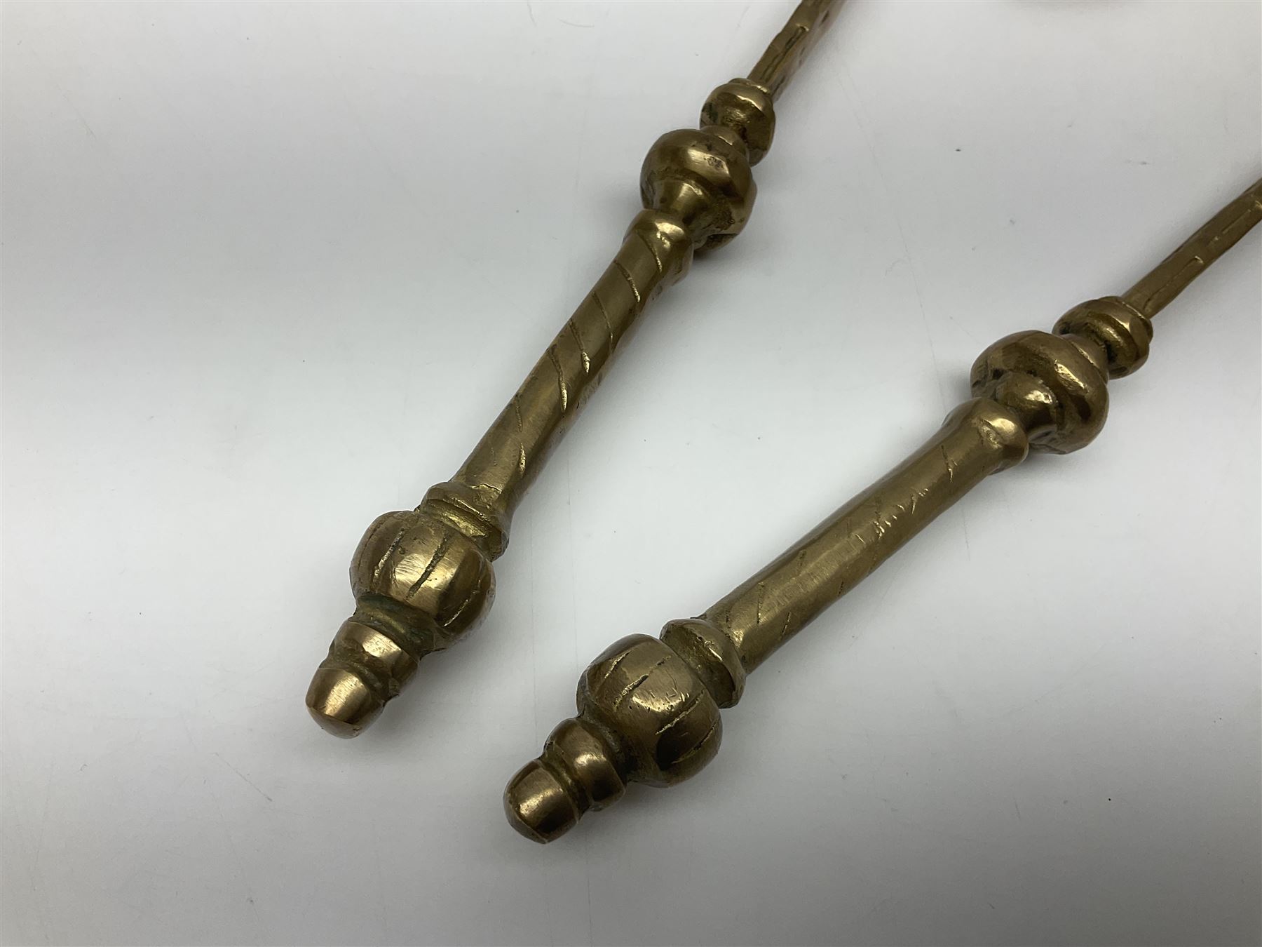 Ornamental cast-brass double-headed axe, together with another similar, H44cm