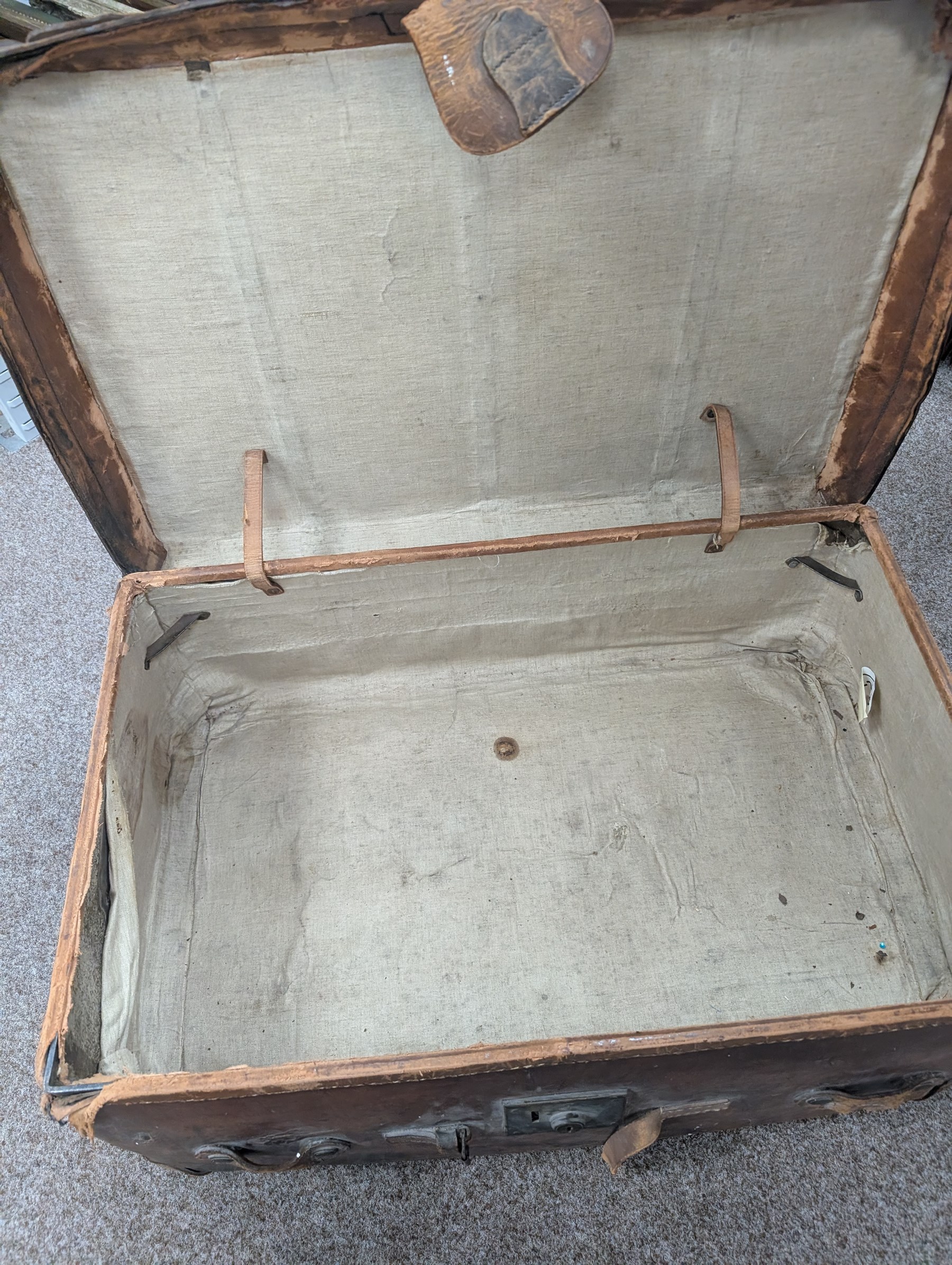 Large leather travelling trunk, together with a vintage suitcase