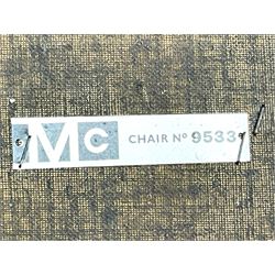 Mid-20th century teak extending dining table, circular top with pull-out extension and concealed leaf extension mechanism, on tapered supports; set of four teak dining chairs with black vinyl padded seats 