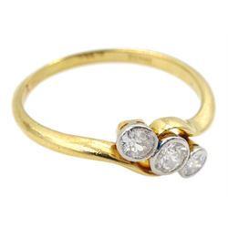 Early-mid 20th century gold old cut three stone diamond crossover ring, stamped 18ct, total diamond weight approx 0.30 carat