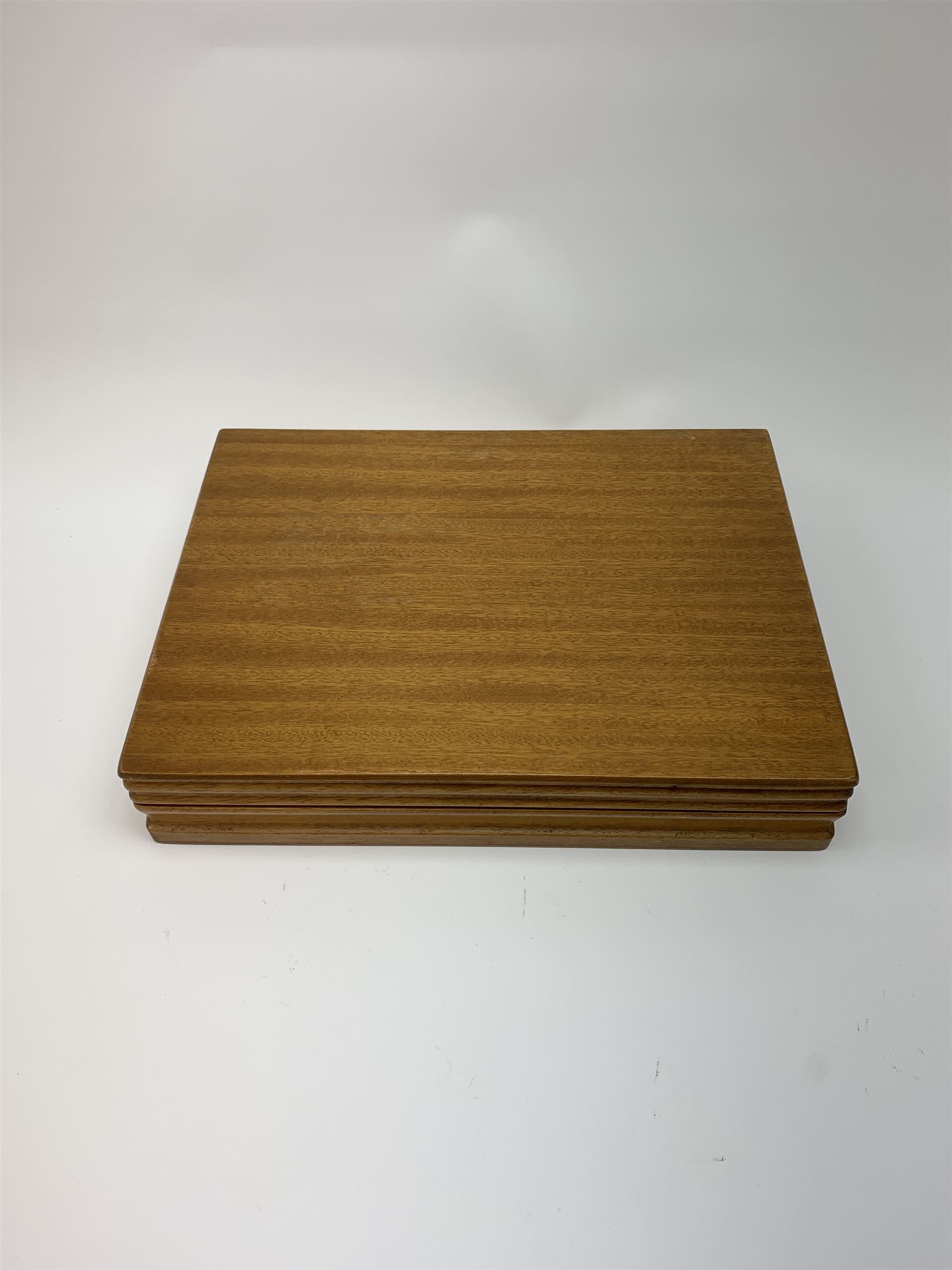 A canteen of bark effect stainless steel cutlery by Gerald Benney for Viners Studio, in a teak case. 