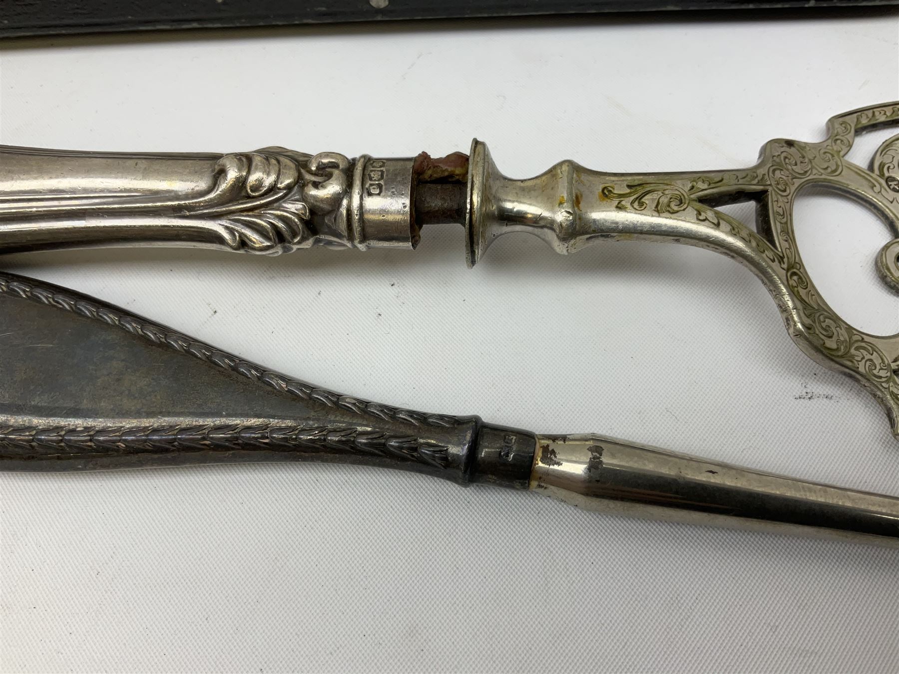 Set of six silver handled butter knives, in case, pair of silver handled fish servers, two silver handled shoe horns, and two silver handled button hooks, all hallmarked or stamped Sterling