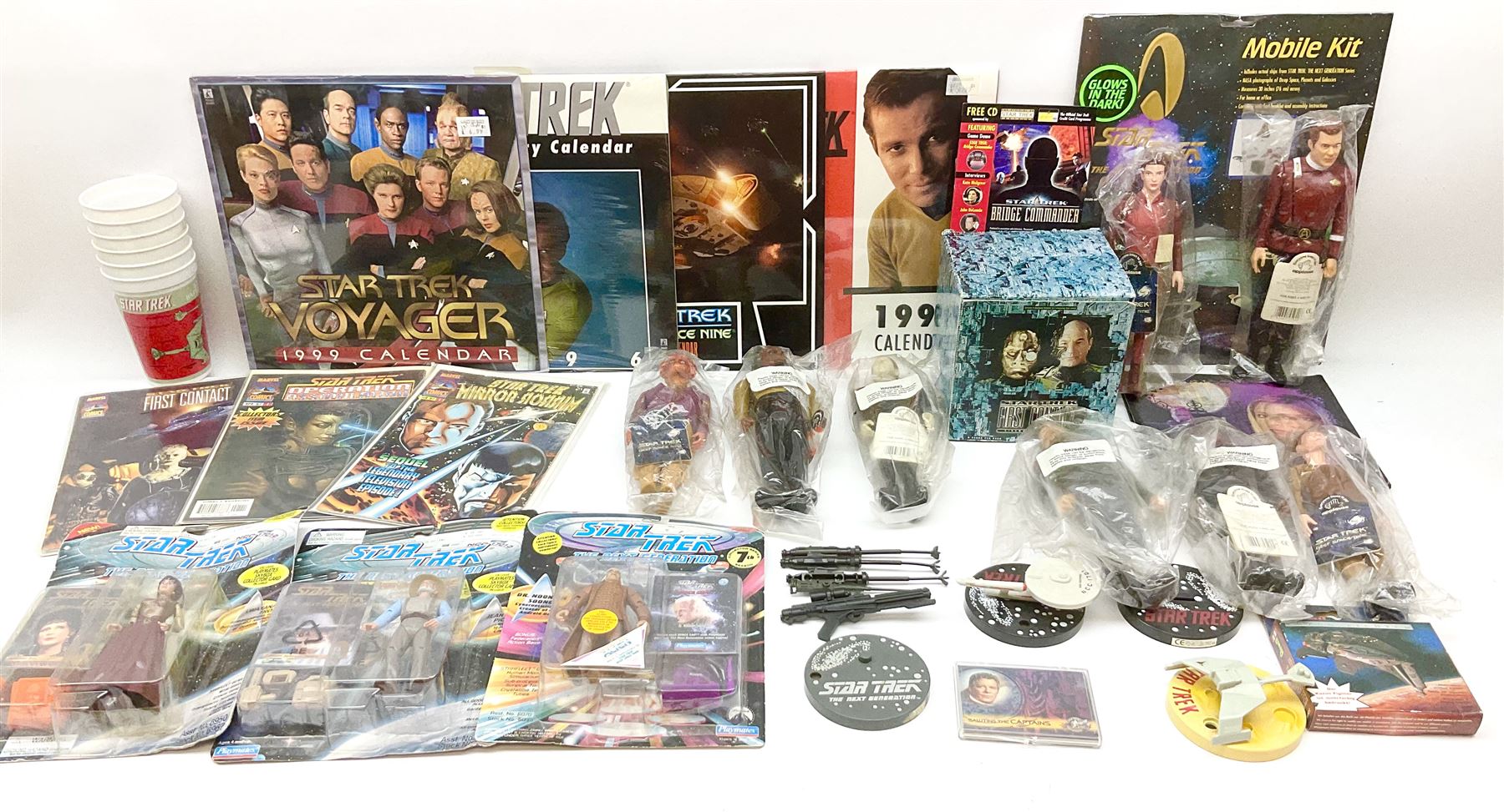 Quantity of Star Trek memorabilia and promotional merchandise including action figures, calendars, mobile kit, collector's fact cards, models etc; many in original packaging