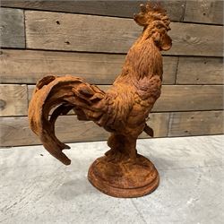 Small cast iron cockerell, on circular base