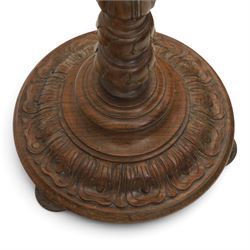 Late 19th Century mahogany standard lamp with shade, canvas beige shade, above a carved and turned column, on a carved base with pad feet