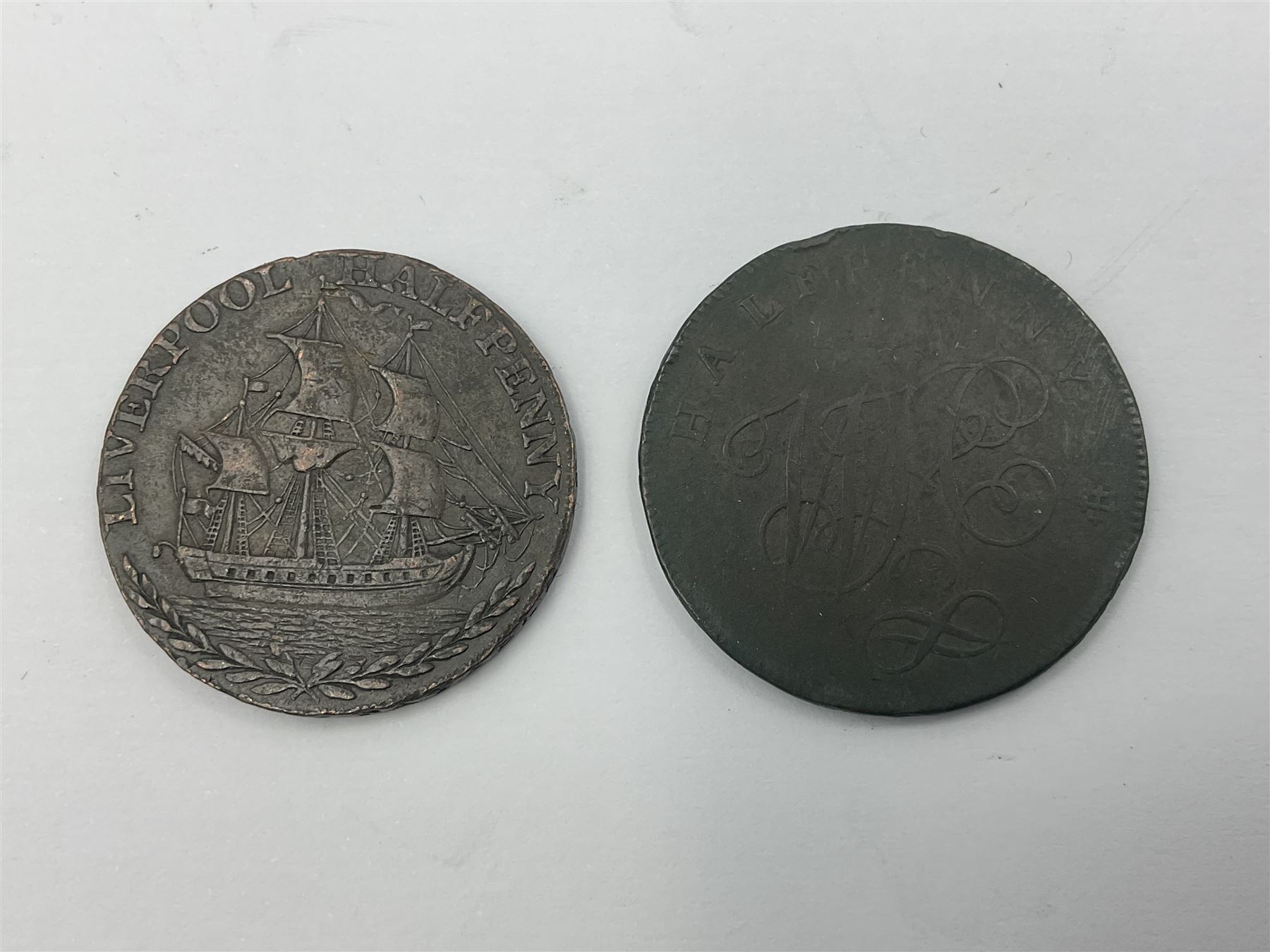 Four Georgian tokens comprising 1791 Liverpool Thomas Clarke Halfpenny, two 1795 Bakers Halfpennies and 1797 Stafford Halfpenny 