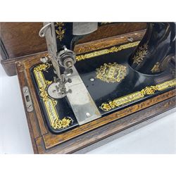 Singer 66 sewing machine in wooden case, together with an LG DVD player with speakers, two portable DVD players, etc 