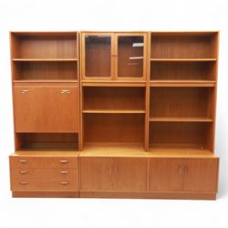 G Plan - Mid 20th century teak sectional wall cabinet, comprising six modular units including a fall front bureau, glazed display cabinet, open bookcase, cupboard and drawer bases, each with recessed handles and flush plinths